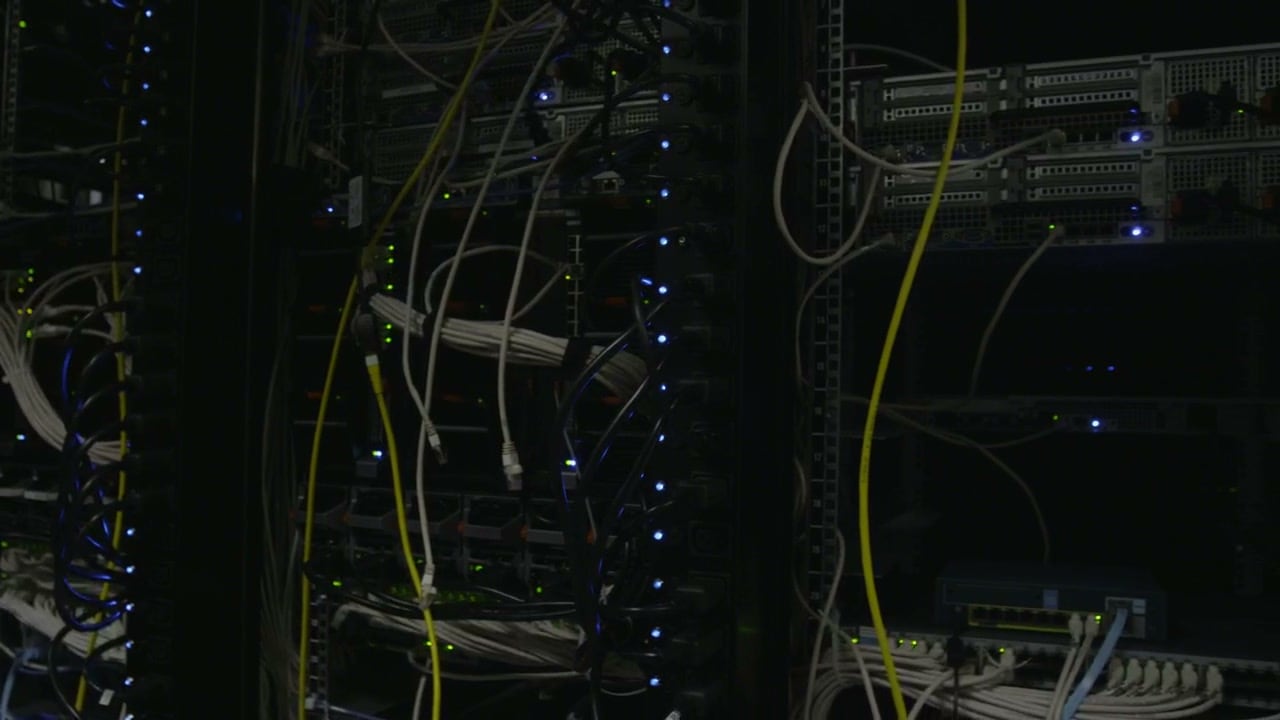 Close-up of a patch panel with XLR and BNC connectors and cabling